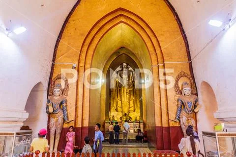 BAGAN, MYANMAR - DEC 6, 2016: Statue of Buddha in Ananda temple in Bagan, Mya Stock Photos