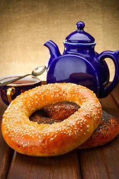 Bagel and tea for breakfast Stock Photos