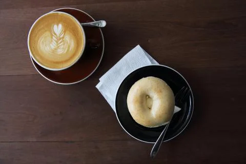 Bagel with coffee Stock Photos