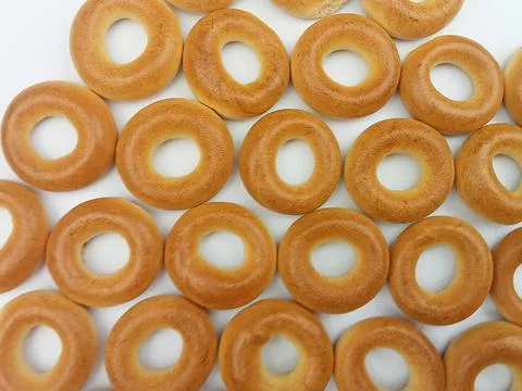 Bagel pattern on white background Stock Photos