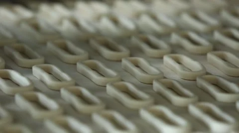 Bagels on the conveyor belt closeup Stock Footage 59777100