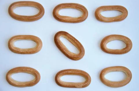 Bagels on a white background. Pattern. Biscuits for drinks 스톡 사진
