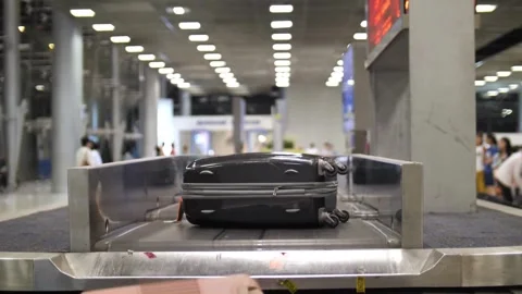 Baggage Bags Moving On Arrival Baggage Belt In Airport 4k luggage Carousel Is Video stock 256744663