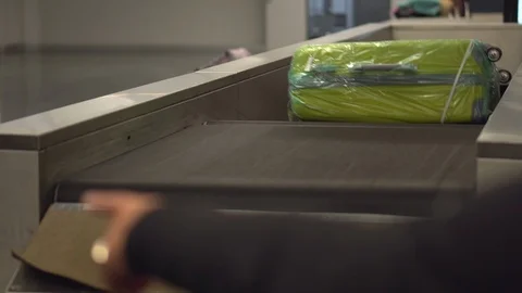 Baggage on a carousel at the airport. Close-up Stock Footage 117915996