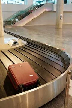 Baggage claim area with empty baggage strap at the airport. Suitcase on luggage 写真素材