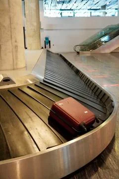Baggage claim area with empty baggage strap at the airport. Suitcase on luggage Stock-Fotos