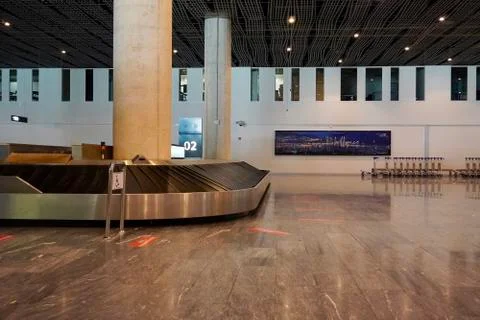 Baggage claim area with empty baggage strap at the airport. Suitcase on luggage Stock-Fotos