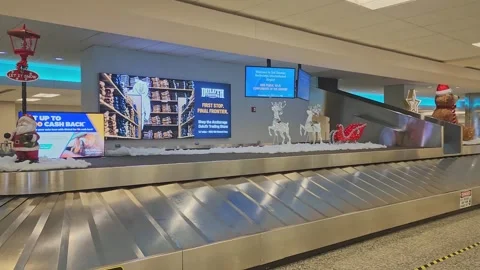 Baggage claim carousel at the Ted Stevens International Airport in Anchorage Stock Footage 325015187