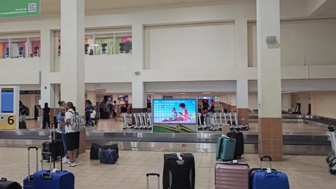 Baggage Claim Hall With Carousel and Luggage, Airport, Montego Bay, Jamaica 8K Stock Footage 340362871