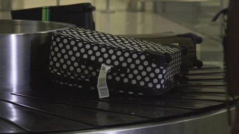 Baggage on Conveyor Stock Footage 129056452