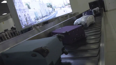 Baggage on Conveyor Stock Footage 129056465