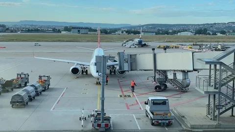 Baggage loading on a plane at the airport stuttgart germany Stock Footage 115395665