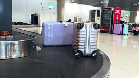 Baggage on a moving conveyor carousel system Stock Footage 331722675