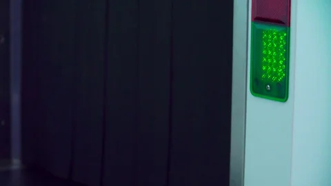 Baggage is scanned in security x-ray scanner. Green LED changes to RED. Stock Footage 82844119