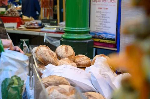 Bagged loaves of bread ready to be paid for at a bread stall in Borough Marke Stock Photos