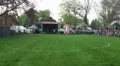 Bagpipe bands timelapse enter the competition place at Highland Gathering HD Footage