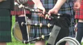 Bagpipe player holding his bagpipe close up at Highland Gathering HD Footage