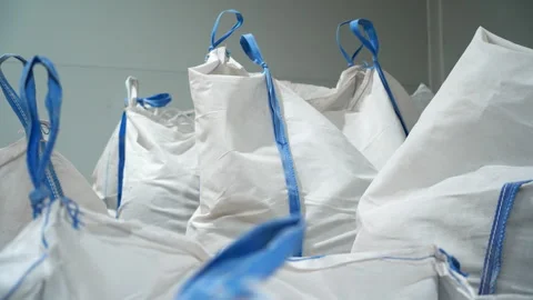 Bags with loop handles filled with recyclable plastic materials 스톡 동영상 304427316