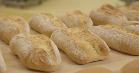 Baguette Rolls Lie In Rows On A Bakery Tray Stock-Footage 340262772