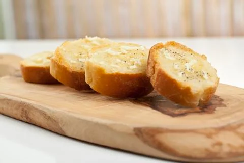 Baguette slices with spread Stock Photos