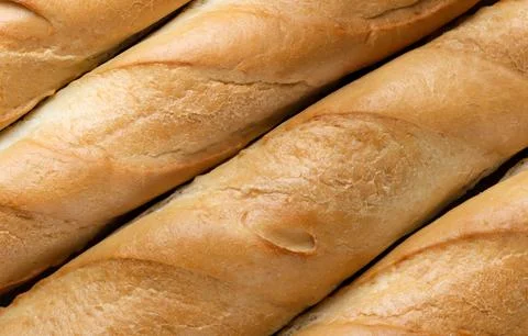 Baguettes of bread closeup, background. Top view Stock Photos