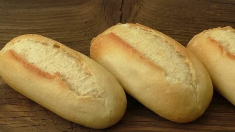 Baguettes on old wooden background Stock Footage 74007233