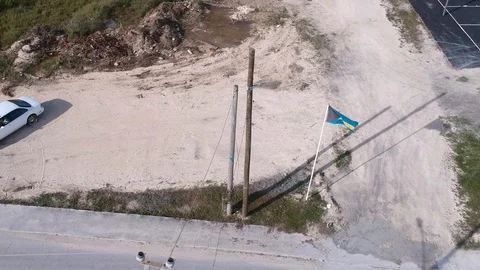 Bahamas Flags Along Main Road Near Basketball Court, Freeport Aerial View Stock Footage 90547815