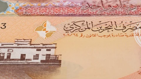 Bahrain dinar notes tracking. Bahraini money. Slider shot, low angle. 4K Stock Footage 125988011