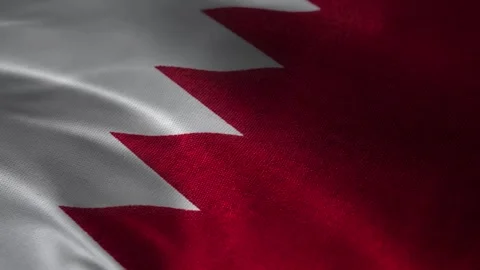Bahrain flag waving macro background with red and white serrated border, patrio Stock Footage 339548107