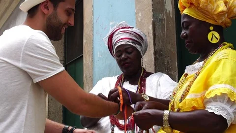 Baianas Welcoming the Tourist giving some