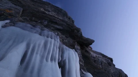 Baikal. Winter. Severe Siberian landscape. Frozen Baikal waves on rocky islands. Video stock 108450737