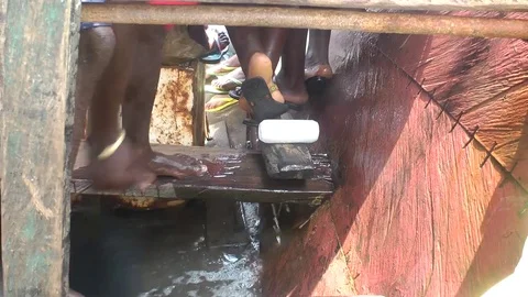 Bailing out water on the pirogue Stock Footage 81484197