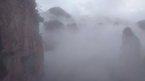 Bailong Elevator Glass Ascent View of Misty Zhangjiajie Peaks Stock Footage 336949493