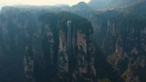 Bailong Elevator - Glass Double-deck Elevator Built Onto The Side Of A Cliff In Stock Footage 328860382