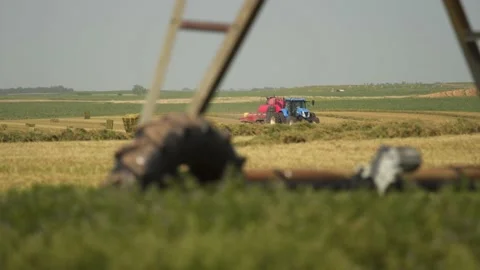 Bailor Baling in the Distance (1) Stock Footage 221861153