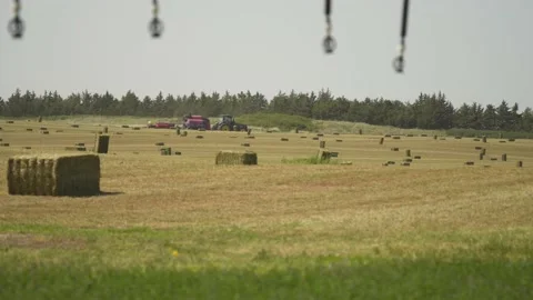 Bailor Baling in the Distance (3) Stock Footage 221861195