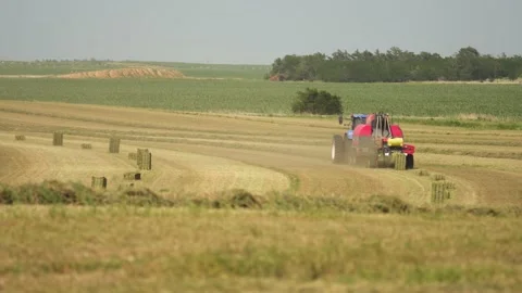Bailor Dropping Square Bales (1) Stock Footage 221861210