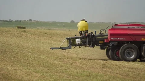Bailor Dropping Square Bales (2) Stock Footage 221861258