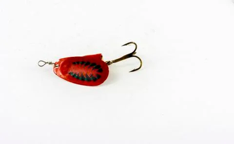 Bait for fishing in the shape of a spoon with a hook on a white background Stock Photos