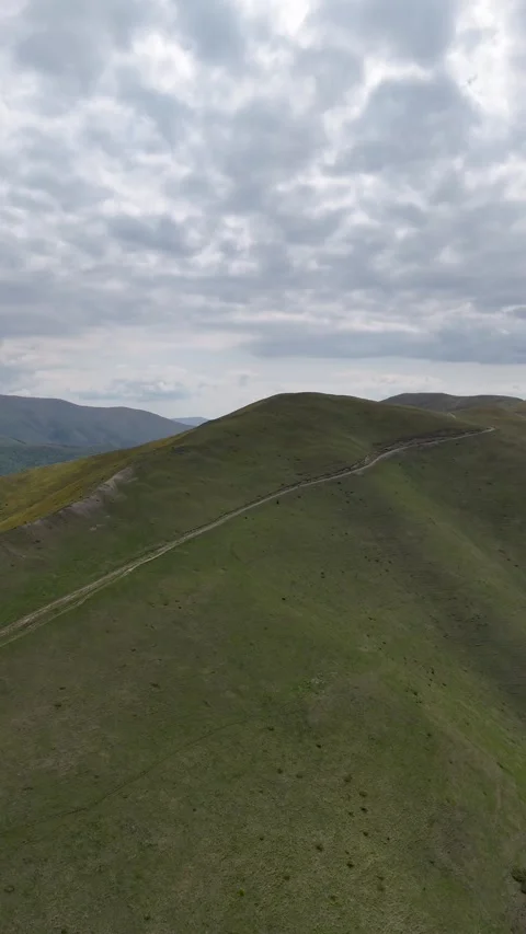 Baiu Mountains open alpine ridge aerial view Romania Stock Footage 335071995