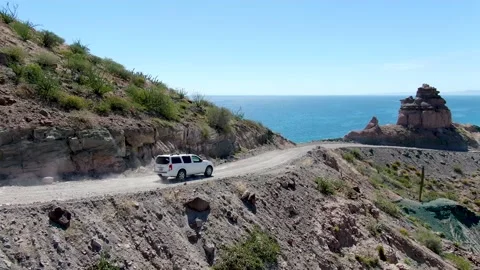 Baja Backroads White SUV along Coast Stock Footage 169773692