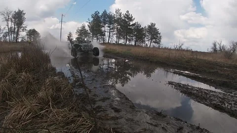 Baja Maverick X3 fast ride through a puddle Stock Footage