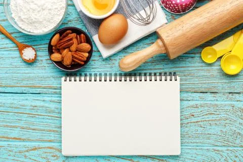 Bake background with notebook and baking ingredients Foto stock