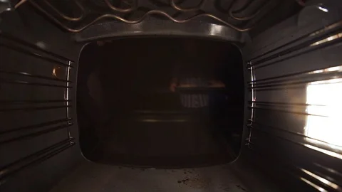 Bake the bread in the oven. Close-up, the boy rejoices. Stock Footage 99632051
