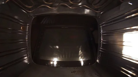 Bake the bread in the oven. Close-up, the brothers happily watching. Stock Footage 99632075