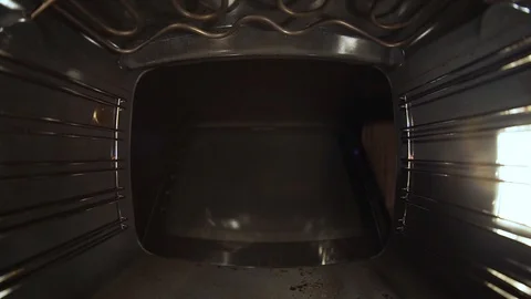 Bake the bread in the oven. Close-up, the girl rejoices. Video stock 99632034