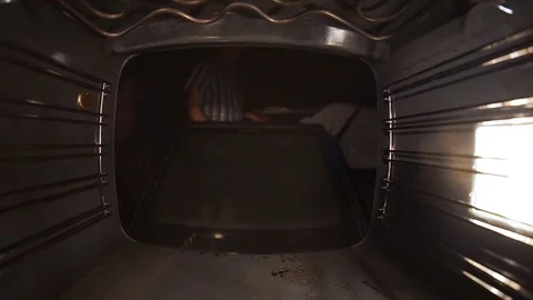 Bake the bread in the oven. Close up, watch out for dough. Stock Footage 99632086