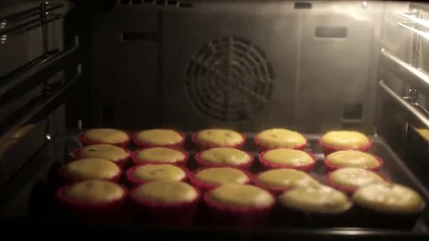 Bake muffins in the oven Stock Footage 69257230