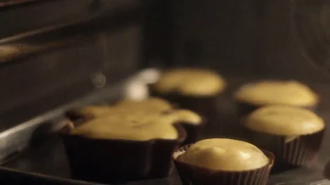 Bake muffins in the oven Stock Footage 69257238