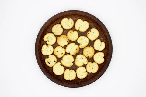 Bake Rolls. The mini bread chips on the brown bowl. Isolated on white backgro Stock Photos